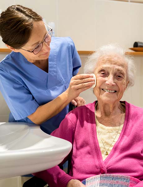 Nurse caring for older woman